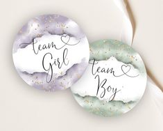 two round coasters with the words team girl and team boy written on them