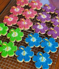 cookies decorated with flowers on a cooling rack