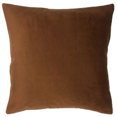 a brown pillow on a white background