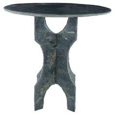 a black marble table with two legs and a circular top, on a white background