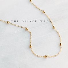 This dainty gold chain necklace, perfect for layering or a minimalist look. •18kt gold plated -lead, nickel & cadmium free•Heavy plating, tarnish resistant, water friendly Adjustable Gold Beaded Necklace With Satellite Chain, Gold Beaded Necklace With Satellite Chain, Dainty Gold-plated Necklace With Satellite Chain, Dainty Gold Plated Necklace With Satellite Chain, Minimalist Gold Plated Ball Chain Jewelry, Minimalist Gold Beaded Necklaces With Tiny Beads, Minimalist 14k Gold-filled Beaded Necklace As Gift, Minimalist Gold-plated Beaded Chain Necklace, Gold Beaded Necklace With Adjustable Chain For Everyday