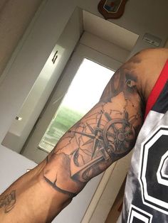 a man with a tattoo on his arm