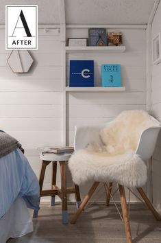 a white chair sitting on top of a hard wood floor next to a book shelf