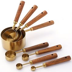 an assortment of kitchen utensils and measuring cups