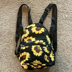 Mini Sunflower Backpack About 11” Long And 8” Wide Never Used And From Nonsmoking House Yellow Backpack For School In Summer, Yellow Summer School Backpack, Yellow Backpack With Adjustable Strap For Back To School, Spring Floral Print Casual Backpack, Trendy Black Backpack For Summer, Trendy Summer Black Backpack, Trendy Black Summer Backpack, Casual Yellow Backpack, Black Backpack For Spring