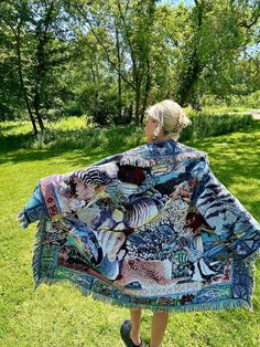 Introducing my latest creation! Upcycled a beautiful woven tapestry blanket into this cozy, one of a kind blanket coat. Features gorgeous underwater ocean life scene. Dreamy, boho wanderlust vibes. Sure to turn heads wherever you may roam. Double front pockets and toggle closure for added functionality. Measurements: Overall length: 40" Pit to pit laying flat: 23" Shoulder seam to wrist: 22" 100% cotton. Machine wash, tumble dry on low heat. This statement jacket was made with all of my heart, for any human, anywhere, that may be attracted to its vibe! My intention is that the piece will amplify the divine nature of your inner being. ✨🌙 Underwater Ocean, Blanket Cardigan, Seashell Print, Tapestry Blanket, Blanket Coat, Statement Jacket, Divine Nature, Woven Tapestry, Woven Blanket