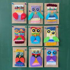 six different owls made out of paper on a green board