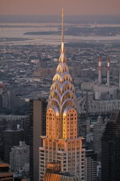 an aerial view of the chrysler building in new york city, ny at sunset or dawn