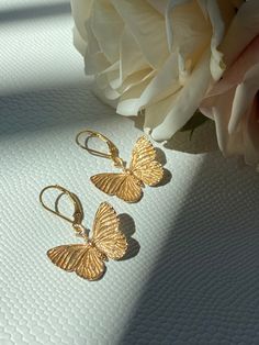 Please Read   Photos are enlarged to show detail. Please read the measurement in the description.  ☑️ The lever back ear wires are 14kt gold filled. ☑️ The charms are Bronze and measure approximately 21x24mm. ��❤️ Follow us on Instagram for new designs and discount codes. @mathewandmarieco Adjustable Butterfly Shaped Yellow Gold Jewelry, Adjustable Butterfly Gold Jewelry, Adjustable Gold Butterfly Jewelry, Delicate Gold Hypoallergenic Earrings, Butterfly-shaped Yellow Gold Earrings For Anniversary, Delicate Hypoallergenic Gold Earrings, Everyday Gold Butterfly-shaped Jewelry, Yellow Gold Butterfly Earrings For Anniversary, Adjustable Hypoallergenic Gold Earrings