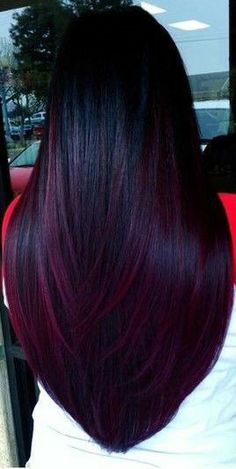 the back of a woman's head with dark red hair