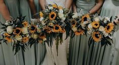 the bridesmaids are holding sunflower bouquets