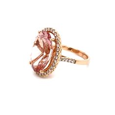 This is a magnificent natural morganite and diamond halo ring set in solid 14K rose gold. The natural and large 18X13MM Morganite oval has an excellent peachy pink color (AAA quality gem) and is set on top of a gorgeous diamond encrusted shank. The ring is stamped 14K and is a true showstopper. This is one of Amy's personal favorite designs! Details: ►Metal: Rose Gold ►Gold Purity 14K ►Natural Gemstone: Morganite (Part of the Beryl Family) ►Gemstone Weight: 11.06 carat ►Gemstone Color: Peachy Pi Oval Morganite Ring In Pink Gold, Oval Morganite Rings In Pink Gold, Pink Gold Morganite Oval Ring, Luxury Pink Oval Halo Ring, Oval Pink Morganite Diamond Ring, Oval Pink Gold Diamond Ring, Halo Ring Set, Morganite Diamond Ring, Halo Ring Setting