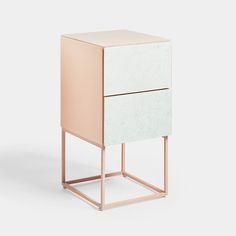 a white and pink cabinet with two drawers