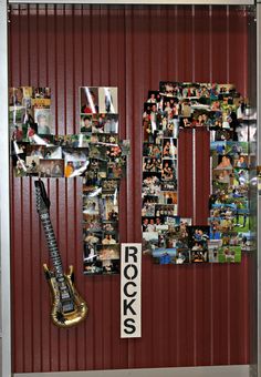 a guitar is hanging on the wall in front of a door with pictures and letters