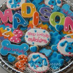 decorated cookies are arranged in the shape of letters