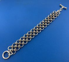 * Sterling Silver Chain Mail Double Row Textured Ring Statement Toggle Bracelet * Length: 8-3/4" * Width: 7/8" * Weight: 80.2 g * Unmarked * Professionally assayed * Condition: Great, as pictured. * S3222    Exported By ExportYourStore :) Elegant Chain Link Bracelets With Jump Ring, Elegant Link Bracelets With Jump Ring, Elegant Metal Chain Bracelet With Jump Ring, Bracelet Ring Chain, Wire Creations, Monkey Tattoos, Jump Ring Jewelry, Simple Silver Jewelry, Chainmail Jewelry