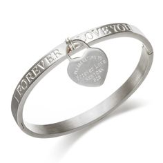 PRICES MAY VARY. FOREVER LOVE DESIGN: Love silver bangle bracelet is featuring with a heart charm, engraved warm words"Forever Love". Eye-catching bangle with hidden clasp is elegant and very easy to get on /off, with 6.5” inner circumference EXCELLENT QUALITY: Made of premium stainless steel, crafted in 18K gold plated for anti-rust and stay color much longer than other metals IDEAL JEWELRY GIFT FOR HER: Well packed in a beautiful velvet bag, minimalist heart charm bracelet is a great celebrati Metal Bangle For Promise Occasion, Metal Bangle For Promise, Metal Bracelets For Wedding And Mother's Day, Metal Heart Bangle Bracelet For Anniversary, Metal Heart Bangle For Anniversary, Heart-shaped Stainless Steel Bracelets For Weddings, Heart-shaped Stainless Steel Wedding Bracelets, Heart Shaped Stainless Steel Wedding Bracelets, Silver Bangle Charm Bracelet For Valentine's Day