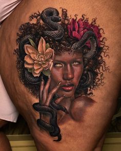 a woman's stomach with a snake and flowers on her head, surrounded by snakes