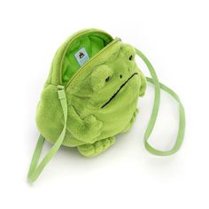 The Ricky Rain Frog Bag is perfect in any weather. With a plump mossy body, bright green lining and strong silver zip to protect your essentials, as well as a webbed strap (and cuddly webbed feet), bright-eyed Ricky makes an excellent guard-frog! Dimensions: 6.7in x 6.7in x 2in Sitting Height: 6in Strap Length: 45in Main Materials: Polyester, Cotton Inner Filling: Polyester Fibers Hard Eye Ricky Rain Frog, Frog Bag, Rain Frog, Plush Bags, Punk Outfits, Cute Stuffed Animals, Cute Bags, Bright Green, Look Cool