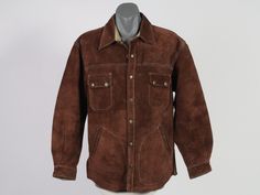 Dark brown vintage Diesel suede leather jacket. Features: - Snap Buttons (working well) - Satin Quilted Lining - Diesel Rivet Buttons - Two Snap-Happy Chest Pockets - Two Slanted Lower Pockets  - White Contrast Stitch - Button Cuff Sleeves Good vintage condition, with minor wear to the leather  - but this adds to the rugged look. We estimate best fits Size M.    Please check your measurements.    The measurements of the jacket are taken with the garment lying flat, and should be measured against similar garments of your own in the same way.                  Shoulder to shoulder -   53 cm / 21 inch                                             Chest - 130 cm / 51 inch                             Sleeve Length -  62 cm / 24.5 inch Base of Collar to Bottom Back -  77 cm / 30.5 inch You Want To Brown Suede Leather Jacket For Work, Western Style Leather Jacket For Workwear In Winter, Western Brown Outerwear For Work, Western Style Brown Leather Jacket For Winter, Western Suede Outerwear For Winter, Casual Brown Suede Leather Jacket, Brown Western Leather Jacket For Winter, Western Style Suede Winter Outerwear, Western Brown Fitted Leather Jacket