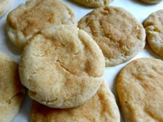 several cookies are arranged on a white surface