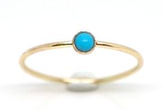 Dainty genuine turquoise ring in 14K yellow gold filled! This dainty turquoise ring has brilliant blue color and can be a perfect addition to your stacking ring! Because of its great color it looks so dainty and beautiful when worn by itself. Turquoise is December birthstone What you will receive.. ONE 14K yellow gold filled ring with 3mm genuine turquoise All items are handmade with love and care! Please choose your size. If you need a special sizing request or sizing question? Don't hesitate t Dainty 14k Gold Turquoise Gemstone Ring, Dainty 14k Gold Turquoise Ring, Stackable Turquoise Ring Gift, Stackable Blue Turquoise Ring In 14k Gold, Dainty Stackable Turquoise Ring, Dainty Turquoise Ring Round Shape Gift, Dainty Turquoise Ring As Gift, Dainty Turquoise Ring Gift, Minimalist Stackable Turquoise Ring