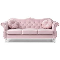 a pink couch with two pillows on it's back and the seat upholstered