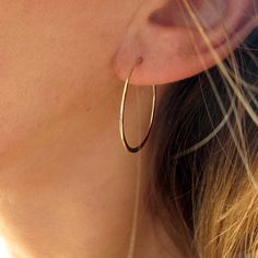 "These delicate hand crafted 14k gold filled, sterling silver, or rose gold filled hoops are hand shaped, filed, forged and polished to a glittering finish. The high quality metal will never turn no matter how much you wear them - just clean them with some windex or warm soapy water and they're good to go! They measure 1\" in diameter, are virtually weightless, and close with a loop in the back. These earrings are in it for the long haul : we only use high quality 14k gold filled and rose gold f Nickel-free 14k Gold Hoop Jewelry, Dainty Rose Gold Hoop Jewelry, Nickel Free 14k Gold Filled Hoop Earrings, Everyday 14k Rose Gold Hoop Earrings, Everyday Rose Gold 14k Hoop Earrings, 14k Gold Filled Pierced Round Hoop Earrings, Nickel-free 14k Gold Filled Hoop Jewelry, Rose Gold Hypoallergenic Hoop Earrings For Anniversary, Delicate 14k Gold Filled Hoop Jewelry