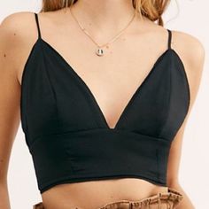 Nwt Free People Black Paradise Brami Top Crop Top!Size Small Style No. 55392328; Color Code: Beautiful Satin Brami Featured In A Longline Silhouette With A Plunging V-Neckline And Flattering Seam Details. Raw-Edge Hems Smocked Stretchy Back Adjustable Straps Intimately Our Softest Intimates And Best-Ever Base Layers. Intimately Is An In-House Label. Care/Import Machine Wash Cold Import Measurements For Size Small Bust: 29.5 In Length: 9.75 In Black Triangle Crop Top For Night Out, Black Triangle Top Crop For Night Out, Black Triangle Top For Night Out, Casual Black Triangle Top Crop Top, Black Triangle Top Crop Top Casual, Trendy Black Triangle Top, Casual Black Triangle Crop Top, Low-cut Black Top With Built-in Bra, Chic Black Triangle Top