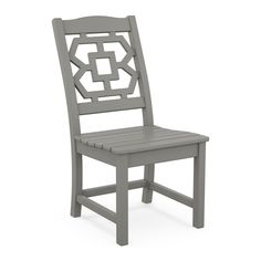 a gray wooden chair with an intricate design on the back and seat, against a white background