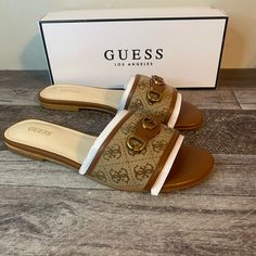 Brand New Guess Hammi Sandal Woman’s Size-7.5 Color- Brown Upgrade Your Grab-And-Go Footwear Collection With The Stylish Hammi Sandal By Guess. This Flat Sandal Has Gorgeous Logo Stitch Work And Accent, Giving Off An Iconic Look. An Elegant Almond Open-Toe Finishes Off The Sleek Design. Guess Sandals Flats, Brown Slides With Branded Insole, Cushioned Flip Flops For Outings, Cushioned Footbed Flip Flops, Guess Sandals, Stitch Work, Ankara Dress, Guess Shoes, Footwear Collection