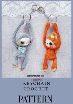 two crocheted keychains with monkeys hanging from them, one is orange and the other is gray