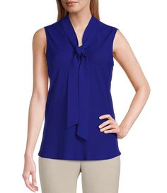 From Kasper, this blouse features:V-neckline with tie front sashSleevelessStraight hemlinePullover constructionPolyesterDry cleanImported. Elegant V-neck Top With Bow, Elegant Sleeveless Blouse With Tie Back, Chic Sleeveless Top With Tie Waist, Elegant Sleeveless Tops With Tie Waist, Formal Sleeveless Top With Bow, Elegant V-neck Top With Tie Back, V-neck Top With Bow For Spring, Spring V-neck Top With Bow Detail, Spring V-neck Top With Bow