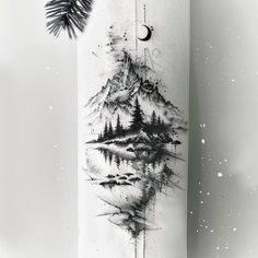 a skateboard with an image of a mountain and pine trees on the side, painted in black and white