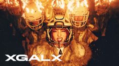 a woman wearing a football helmet with flames in the background and text that reads galaxy