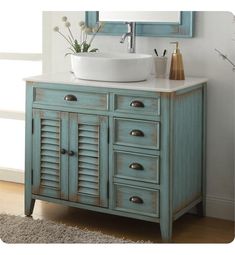 a bathroom vanity with a sink and mirror