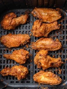 chicken wings cooking in an air fryer