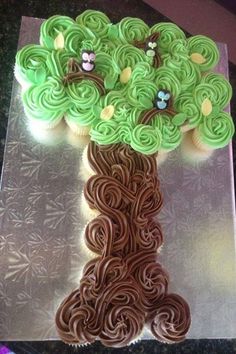 a cupcake decorated like a tree with swirls