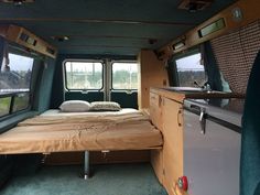 an empty bed in the back of a vehicle