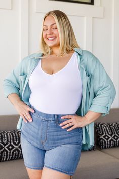 An absolute must in every wardrobe! The Unwavering Confidence Blouse will become one of your most worn pieces! Such a versatile top, from layering it underneath sweaters and vests, to wearing it unbuttoned with a basic tank underneath, or just wearing it buttoned up as is. Get your hands on this staple piece asap! Lightweight + Roll tab sleeves Roll tab sleeve + Functional pockets 100% Rayon Wash cold, hang dry No Stretch, Size Up One for Comfort Fit Through Chest *Measurements listed below are Mommy And Me Swimwear, Midi Bridesmaid Dress, Blue Denim Pants, Athleisure Tops, Bralette Crop Top, Wide Brimmed Hats, Knee Length Dresses, Plus Size Swimwear, Basic Tops