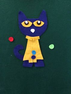 a blue and yellow cat made out of paper