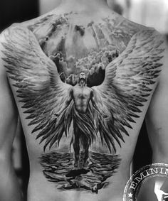 the back of a man with an angel tattoo on his chest and wings above him