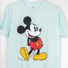 Brand New With No Tags, No Defects On Item. Classic Mickey Logo On The Front. Color Is Mint Green Size: Medium 60%Cotton 40%Polyester Measurments (In Inches) Sleeve: 8.5 (Shoulder Seam To The End Of The Sleeve) Width: 20 (Armpit To Armpit) Length: 28 (Back Collar To Hem) Disney Green Crew Neck T-shirt, Disney Blue Top For Streetwear, Mickey Mouse T-shirt For Disney Trips, Disney Green T-shirt With Crew Neck, Disney Mickey Mouse T-shirt For Streetwear, Green Disney Crew Neck T-shirt, Green Disney Crew Neck Top, Disney Green T-shirt With Graphic Print, Green Disney Graphic Print T-shirt