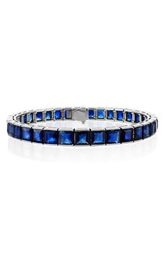 Princess-cut sapphires lend striking cerulean beauty to this polished platinum tennis bracelet from the label's sculptural, statement-making Icon Collection. 7" length Tongue-and-groove closure Total sapphire weight: 16.50ct. Platinum/sapphire Made in the USA Luxury Sapphire Gemstone Tennis Bracelet, Formal Blue Bracelet With Polished Finish, Blue Bracelets With Polished Finish For Formal Occasions, Luxury Sapphire Tennis Bracelet For Formal Occasions, Luxury Sapphire Gemstone Bracelets, Luxury Sapphire Bracelet For Formal Occasions, Formal Sapphire Tennis Bracelet In Fine Jewelry Style, Formal Sapphire Tennis Bracelet Fine Jewelry, Luxury Sapphire Tennis Bracelet