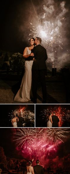 a couple standing next to each other in front of fireworks