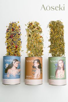 three cans filled with different types of herbs