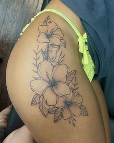 a woman's thigh with flowers on it