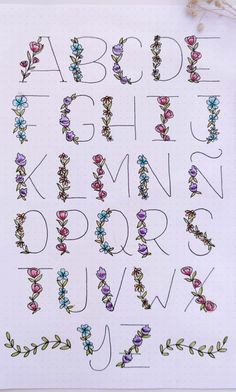 the letters and numbers are decorated with flowers on white paper, which has been drawn by hand