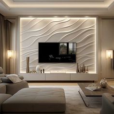 a living room with white furniture and a flat screen tv mounted to the side of a wall