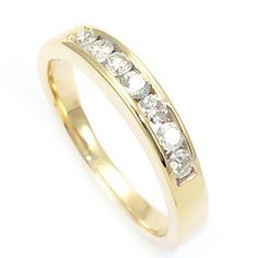 "A classic Ladies Band with round diamonds, channel set in 14k yellow gold. COMPONENT DIAMOND:  7 Round Diamonds CARAT WEIGHT: 0.40ct COLOR/CLARITY: G - H / SI METAL: 14K Yellow Gold GRAM WEIGHT: 3.51gr WIDTH:  3. 5 m  DEPTH:  2. 7  m  STYLE CODE: LR730 - KR1103 This item can be made in 18K white, yellow & rose gold & Platinum.  These are made to order and will take approximately 1 to 2 weeks. Please contact us for ring size above 7 and if you have your own idea or would like to customize this p Rings Ladies, Dolphin Ring, Ladies Rings, Jewelry Words, Custom Pendants, Small Earrings Studs, Star Ring, Channel Set, Photo Bracelet